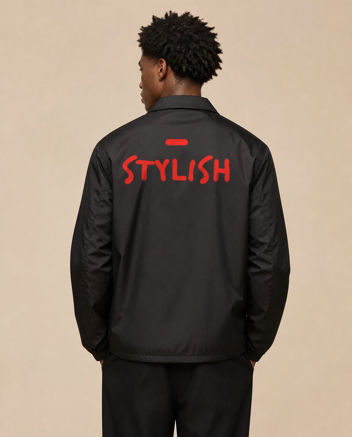 Back print of the black coach jacket